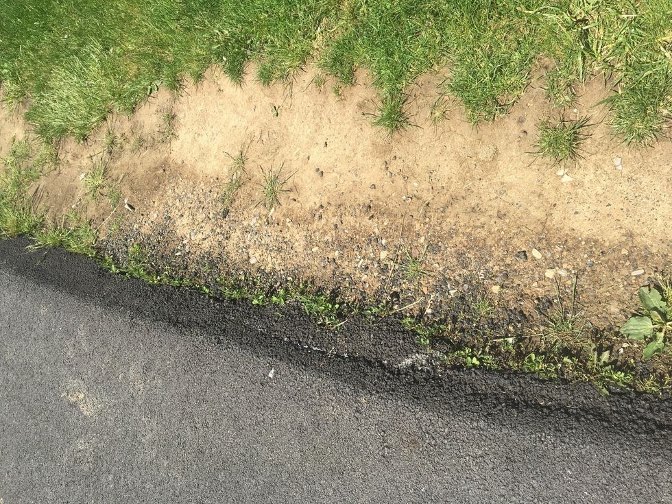 This picture represents deposition. We know this because in the picture looks like rocks came to the curb and settled there. This filled out that part of the hill.