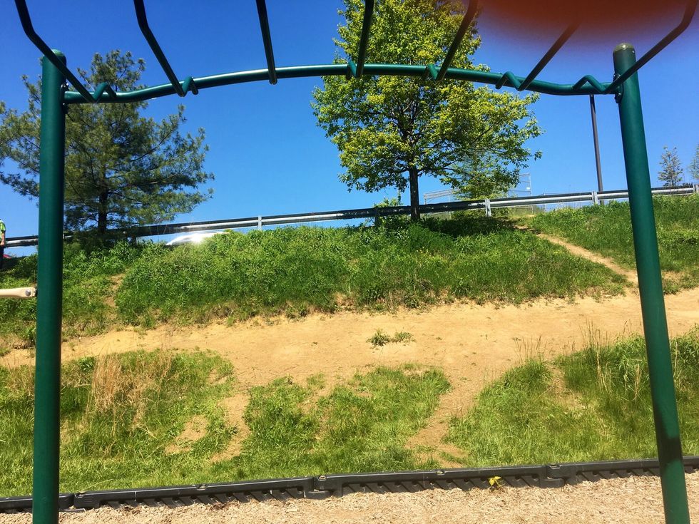 This picture represents erosion. It does because it looks like the dirt eroded from the top of the hill to the middle.