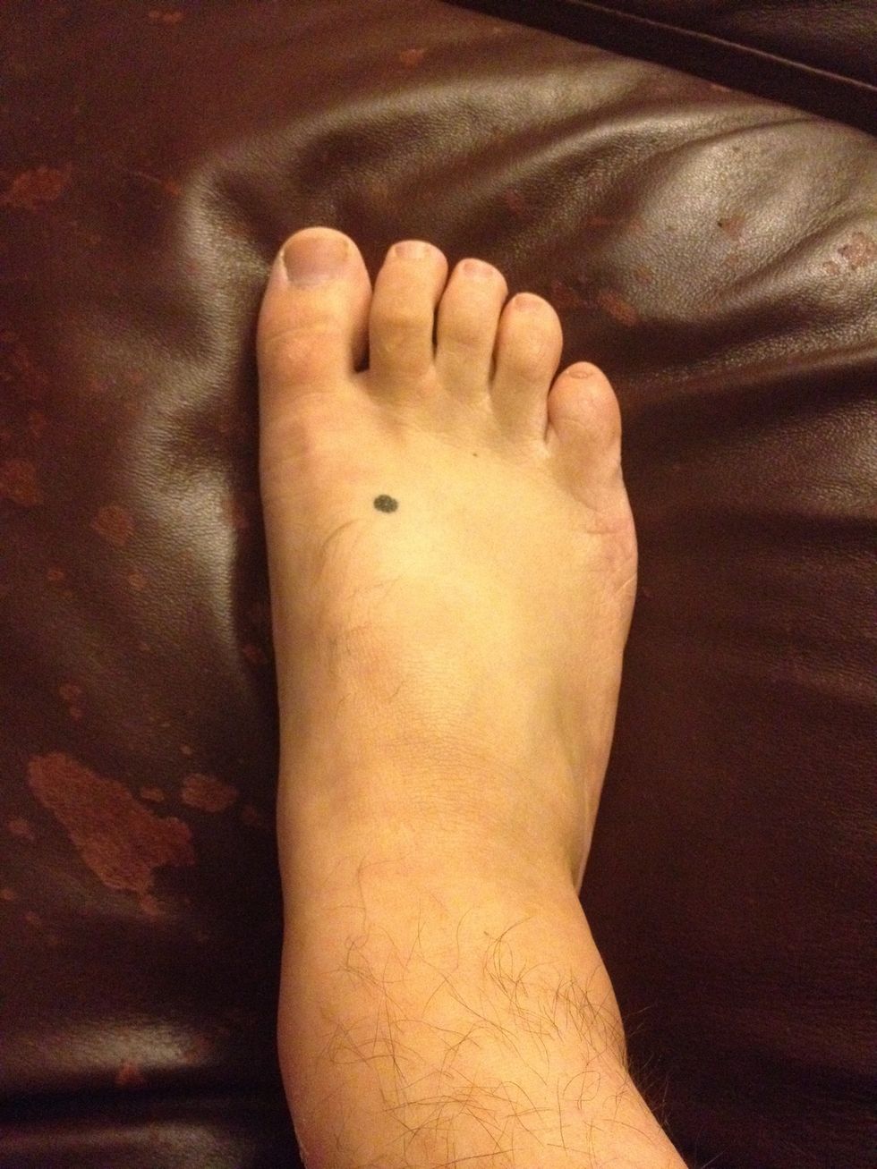 This point is located on the top of the foot. Follow the space between the first and second toe onto the top of the foot. Find the sore spot between the two bones.