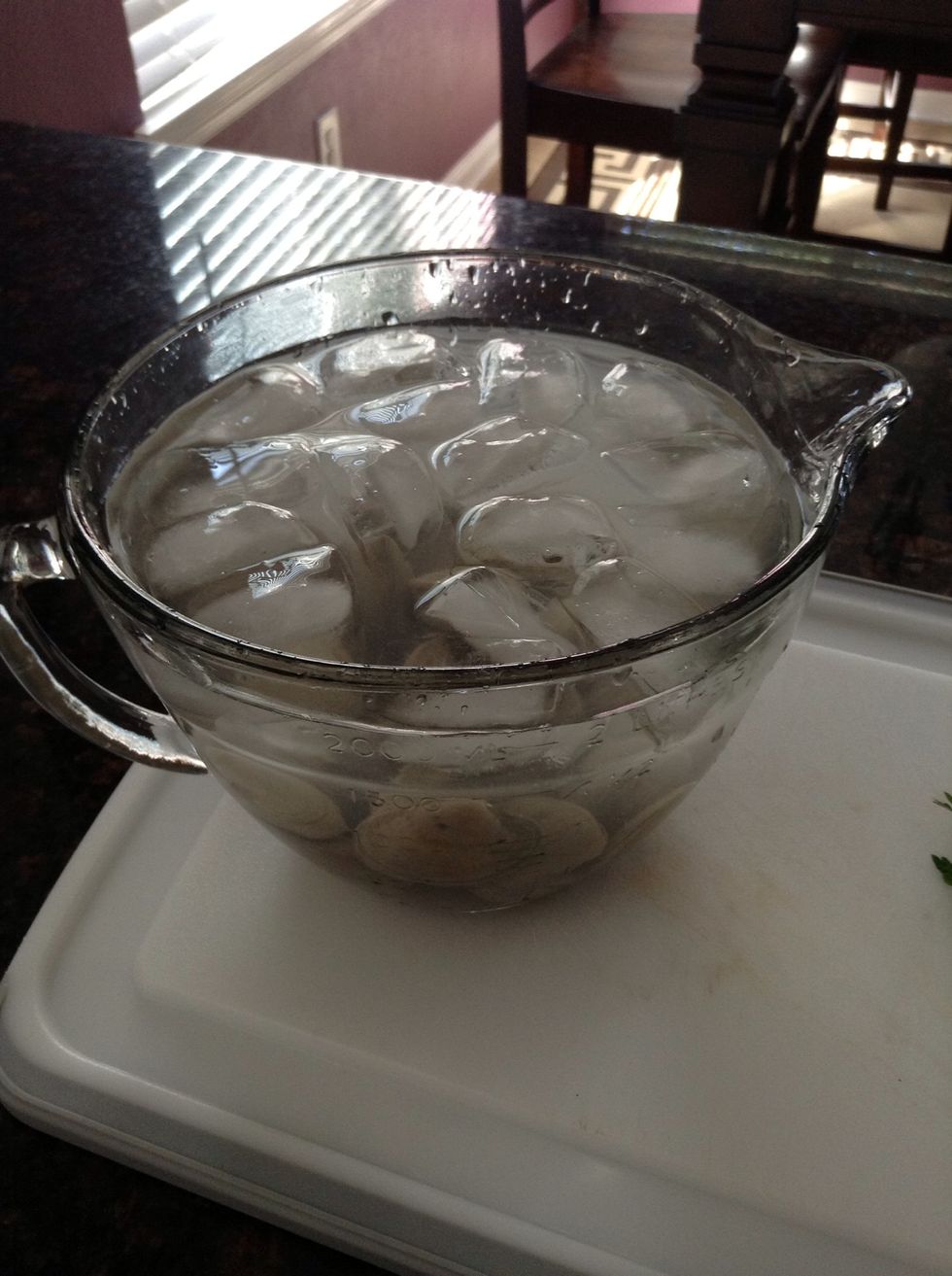 This process is to purge the live clams; it gets the sand out of them. Let them soak for about 10 minutes while you prepare the sauce.