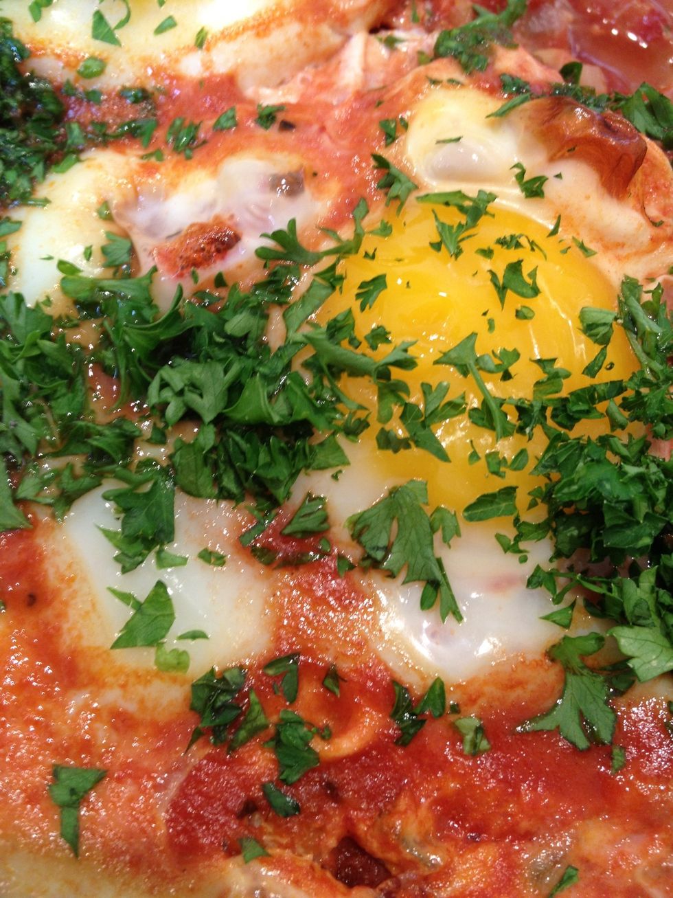 This recipe is a combination of the basic shakshuka recipe from The Book of New Israeli Cooking and the Poached Eggs with Chickpeas recipe from the December 2011 Bon Appetit.