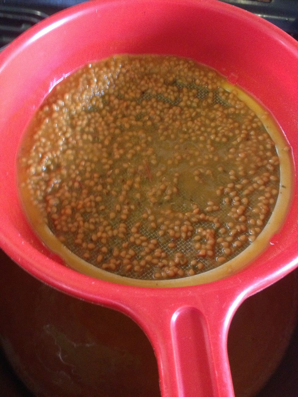 This removes the seeds. Remember to scrape the bottom of the sieve.