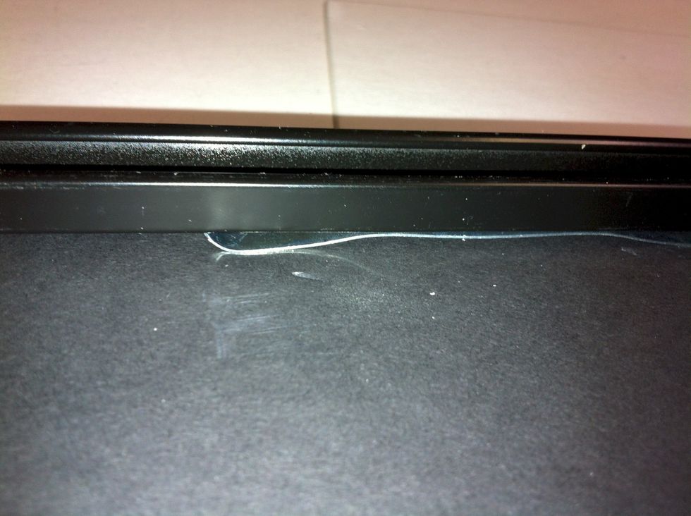 this shows how the spring clip has been flattened and slid under the lip.