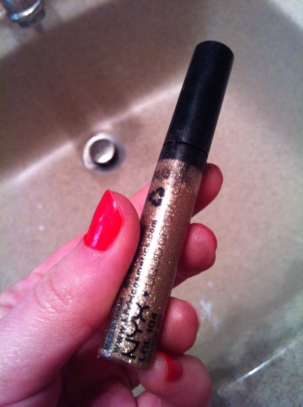 (This step again is optional) using a gold glitter liner you can apply this to the outer edge of your top eyeliner for some extra sparkle