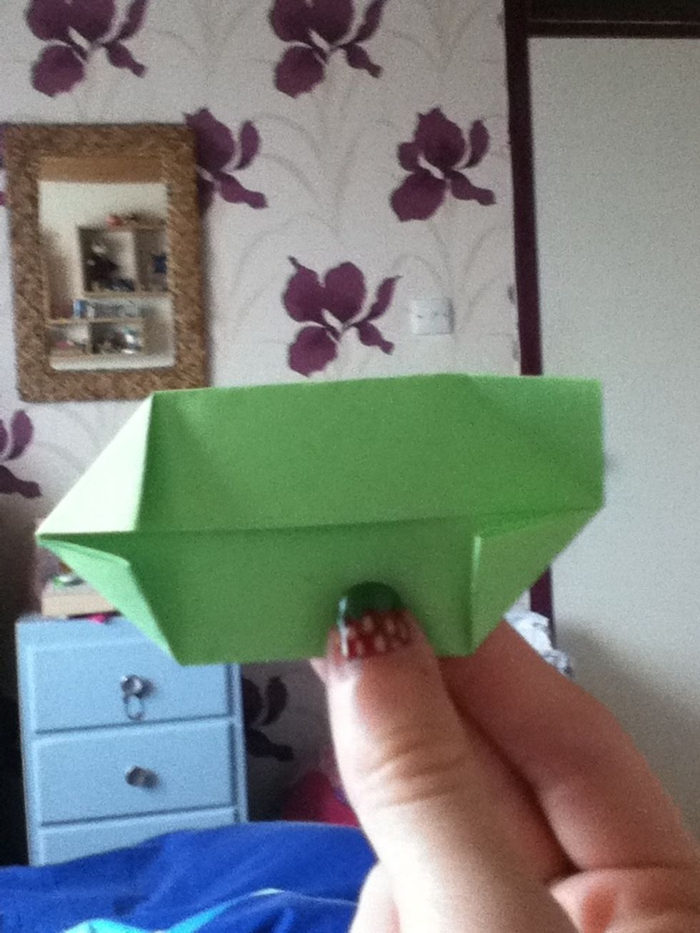 This step is more difficult, so I'll try and take it slow. Fold one of the corners out.