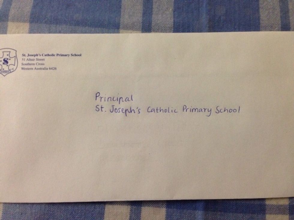 This step is only needed if you are writing to someone at a business or place of work. As I have addressed my envelope to a Principal of a school I have written the name of the school.
