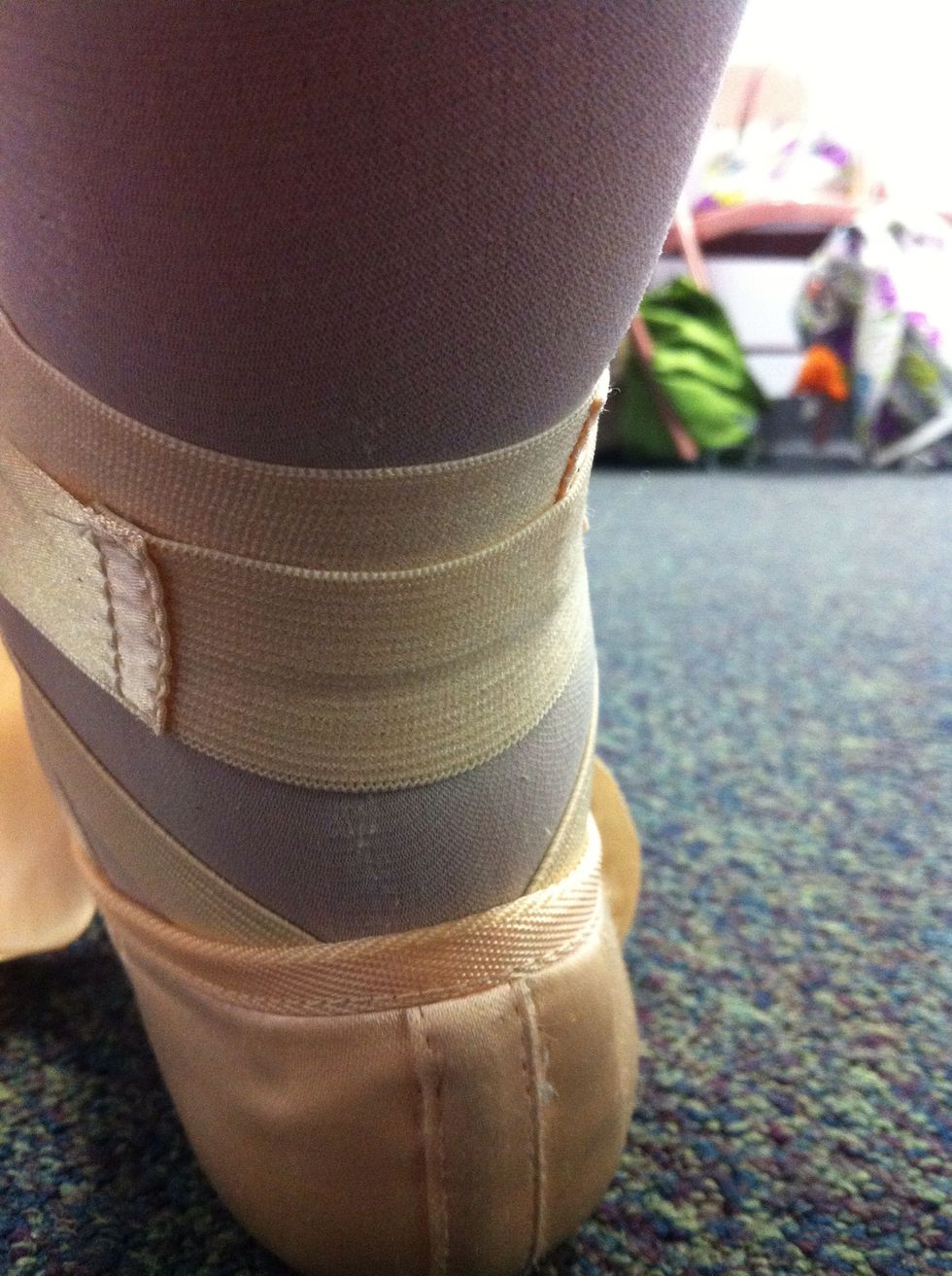 This step is very important.... make sure the elastic on your Ribbons covers your Achilles for support. This will help in the long run with injuries.