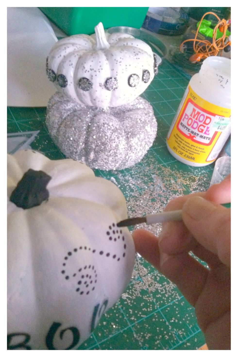 This takes somewhat of a steady hand if painting the design freehand. I use my pinky to steady my hand.