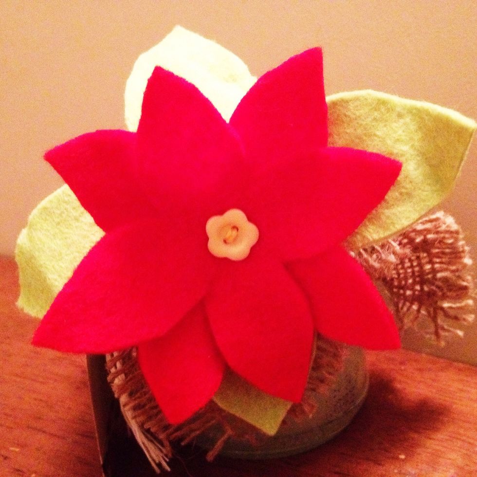 This technique works extremely well with felt too.  Here's a felt poinsettia I made to decorate a christmas gift, I have also used these flowers on hair accessories and jewellery :-)
