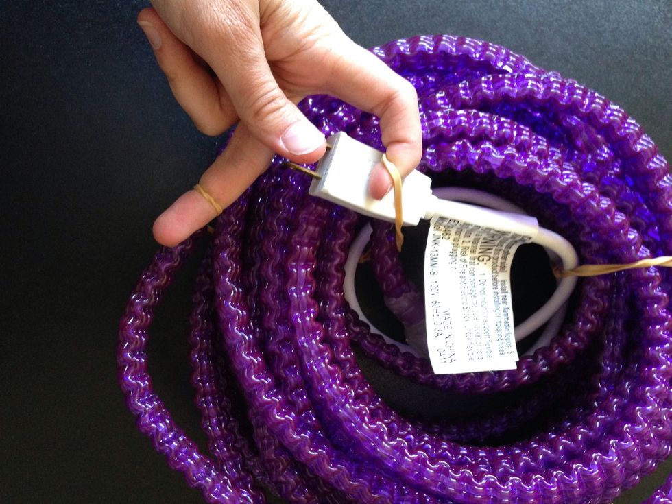 This time take the other end of the lights and pull it out from of the coils.