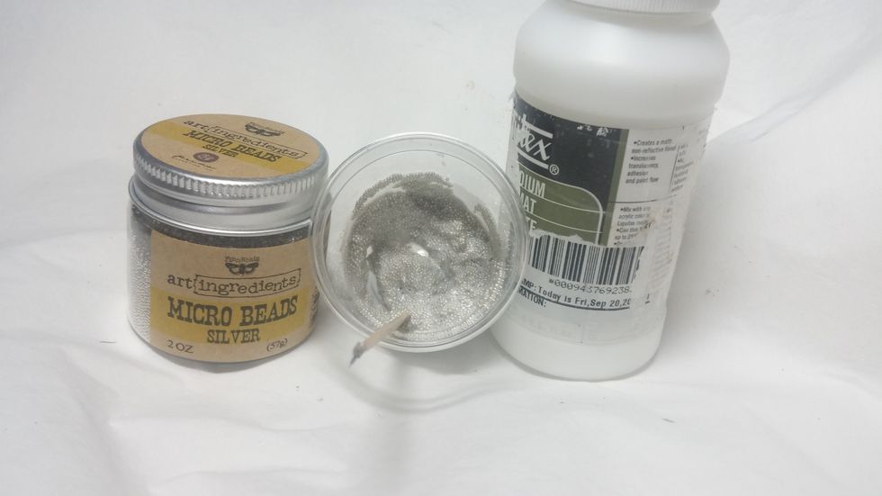 This was a fun experiment. I recently got some of these silver micro beads. They were mixed with liquid medium and smothered on the corners of the piece.