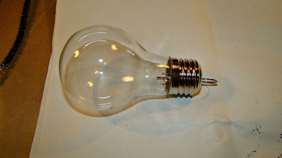 This was an ornament from last year which will be taken apart and bugs will be added, but you can just use an old light bulb around the house if wanted. Paint the silver top with Black Leather Jacket.