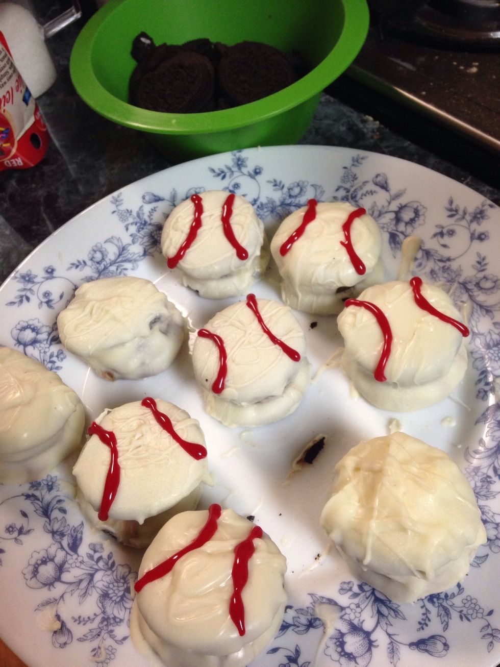 This was very messy and hard for me & I couldn't take a picture of the process, I had 2 plates and I put a dab of the melted white chocolate on the plate, and placed my Oreo Reese's on top of it