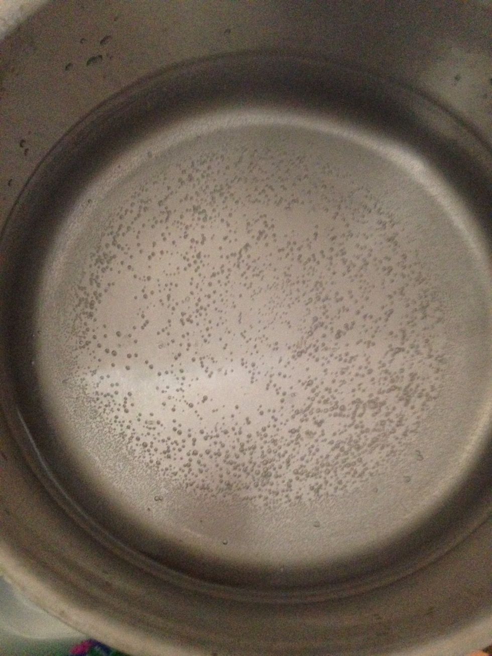 This water is at its simmering stage because tiny bubbles are now rapidly forming. A simmer is not a boil- it is the stage just BEFORE the boil. \n