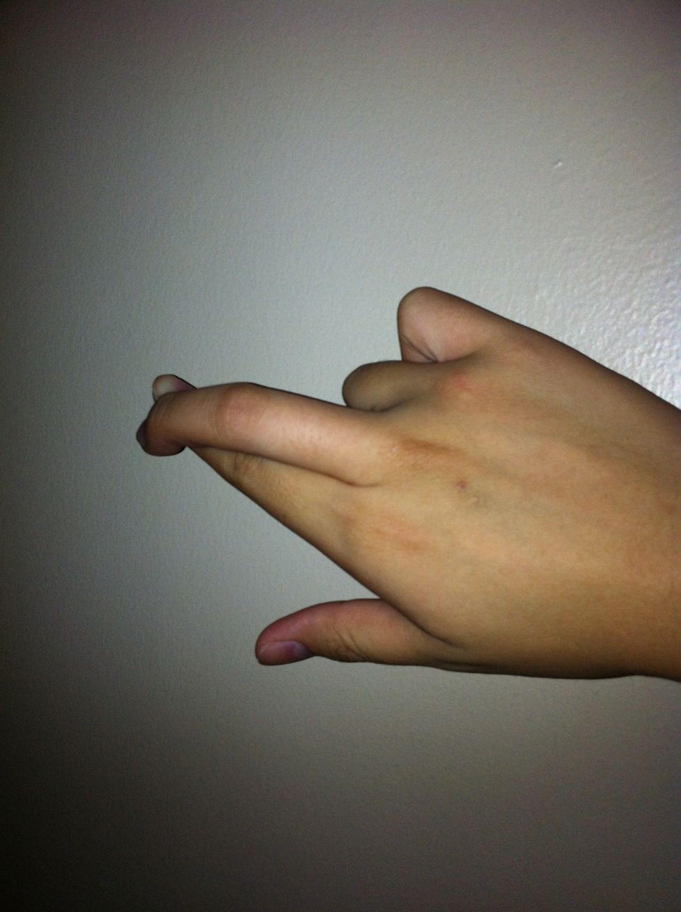 THIS WAY..put your middle finger above the first finger