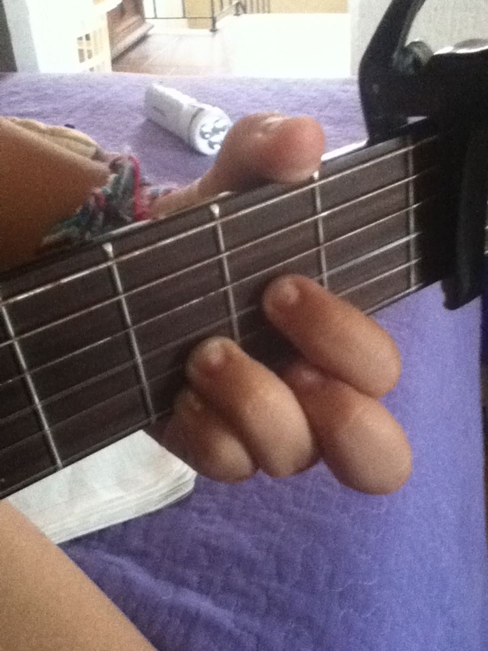 This will be our second chord. You wont move the void and pinky fingers. You wont use the middle finger, but you put the index in the second fret (4th).