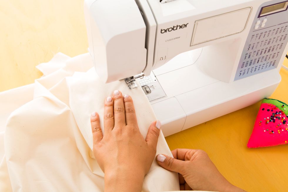 This will equal four and a half feet centered in the middle of your fabric and will serve as the part that hooks to the back of your car.