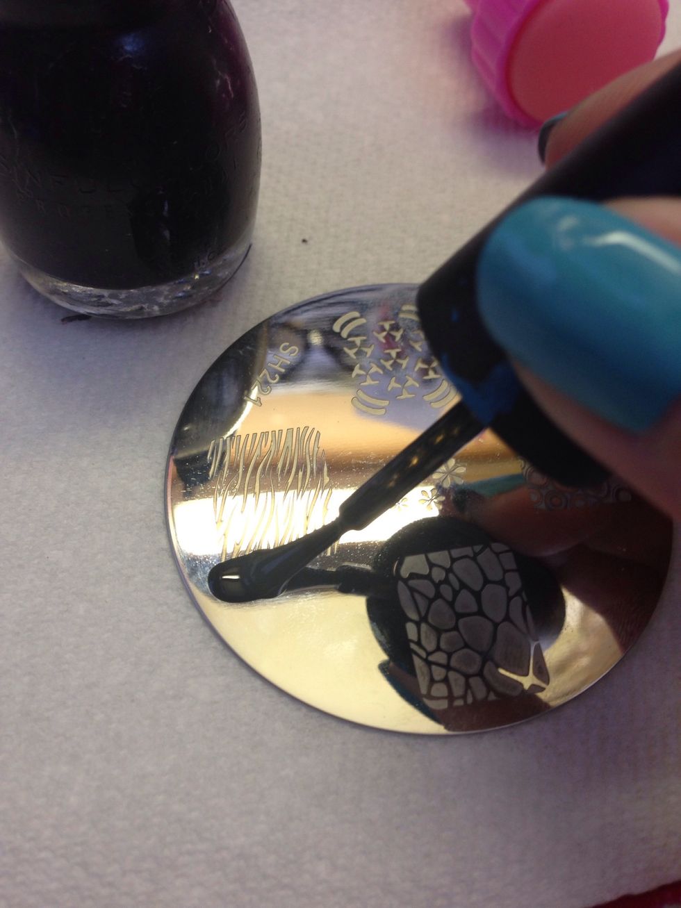 This will take practice. Paint a thick line of polish at the base of your design. Smaller designs can be done the same way. Pick a spot that will cover the whole engraving when you scrape.