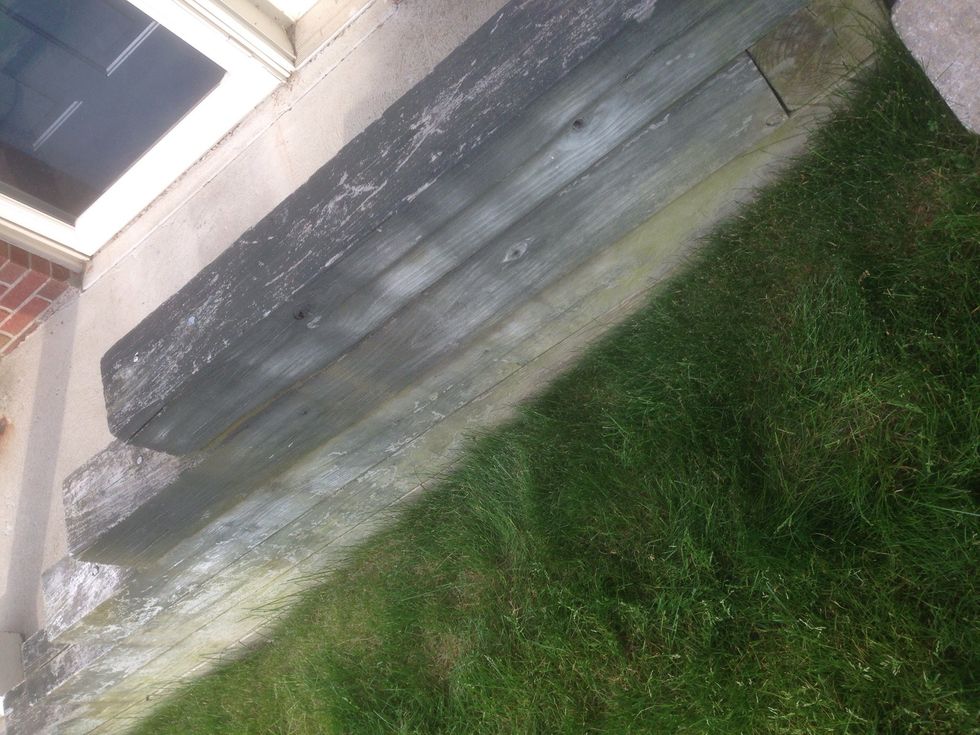 This wood wall prevents erosion for sediment to pile up around the front door.