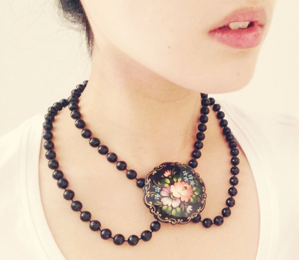 This would look just as pretty with a strand of faux pearls. You could also use a bow or any other hair clip instead of a brooch.