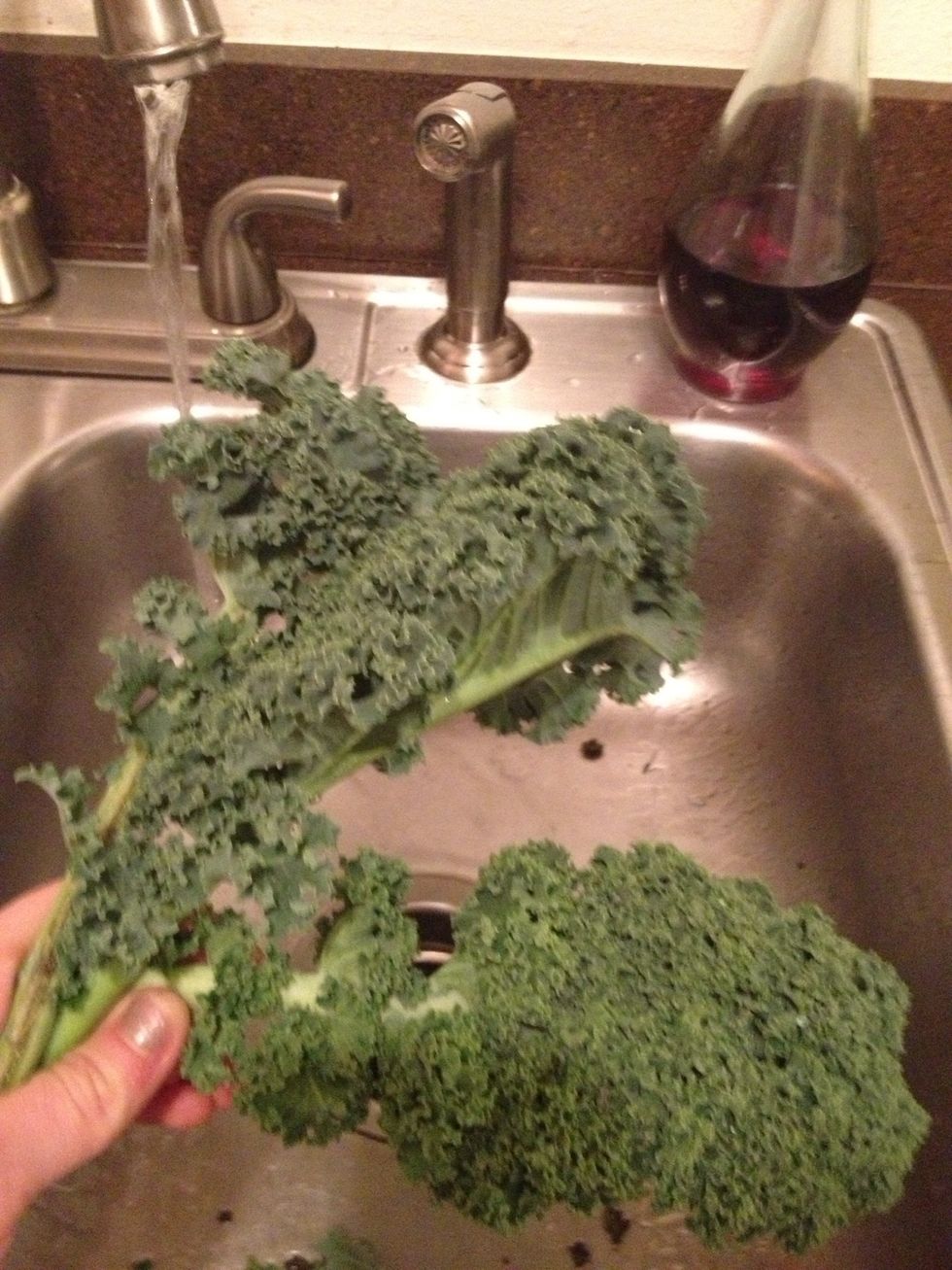 Thoroughly rinse your Kale, making sure to shake excess water off.