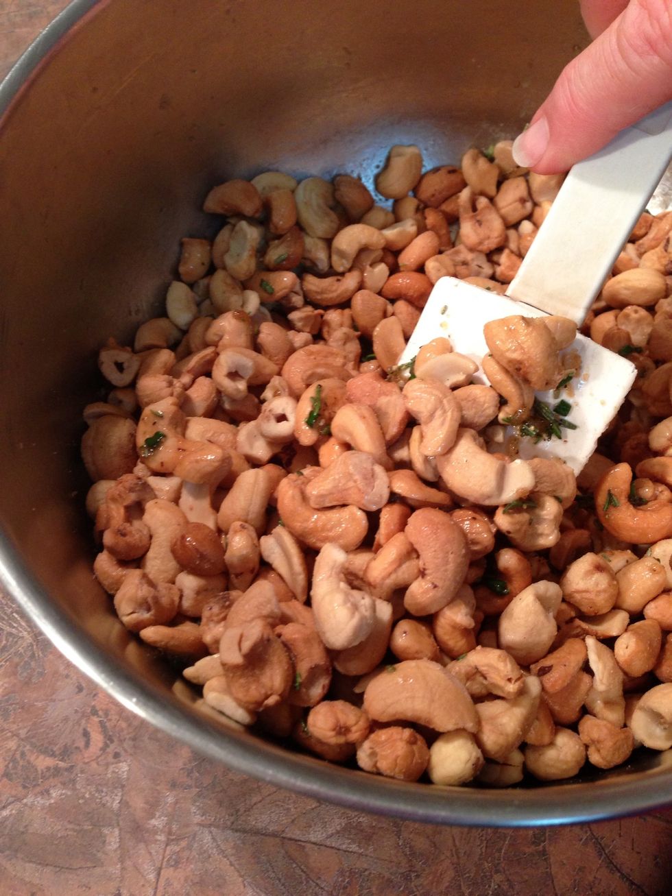 Thoroughly toss warm Cashews with the spiced butter...