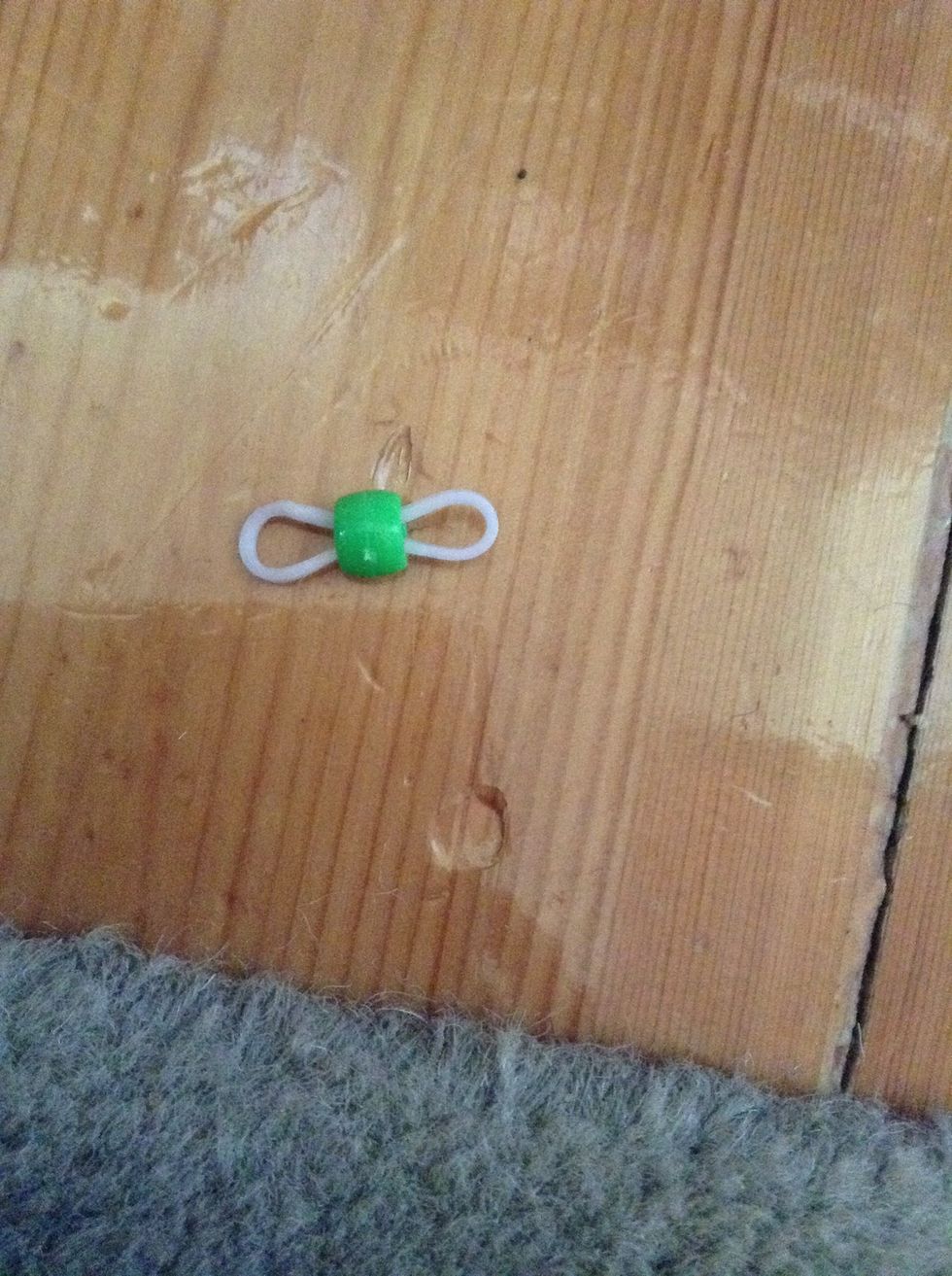 Thread a pony bead on a band.