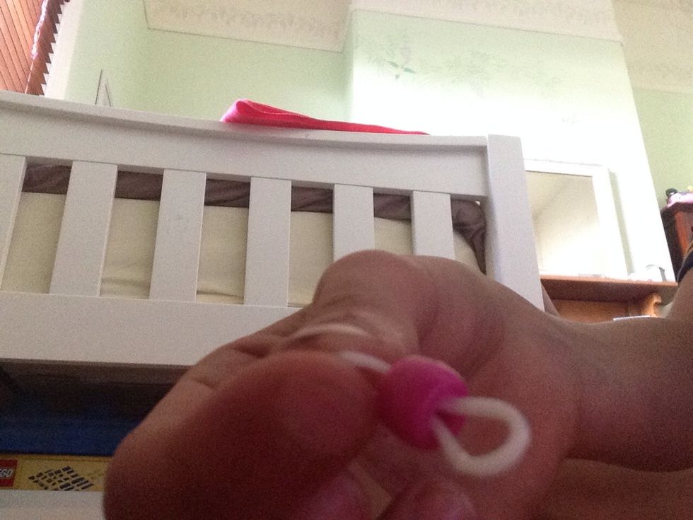 Thread a pony bead on to a band.