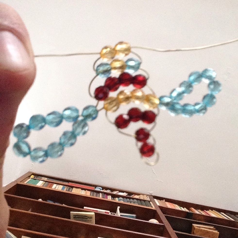 Thread a row of two yellow beads