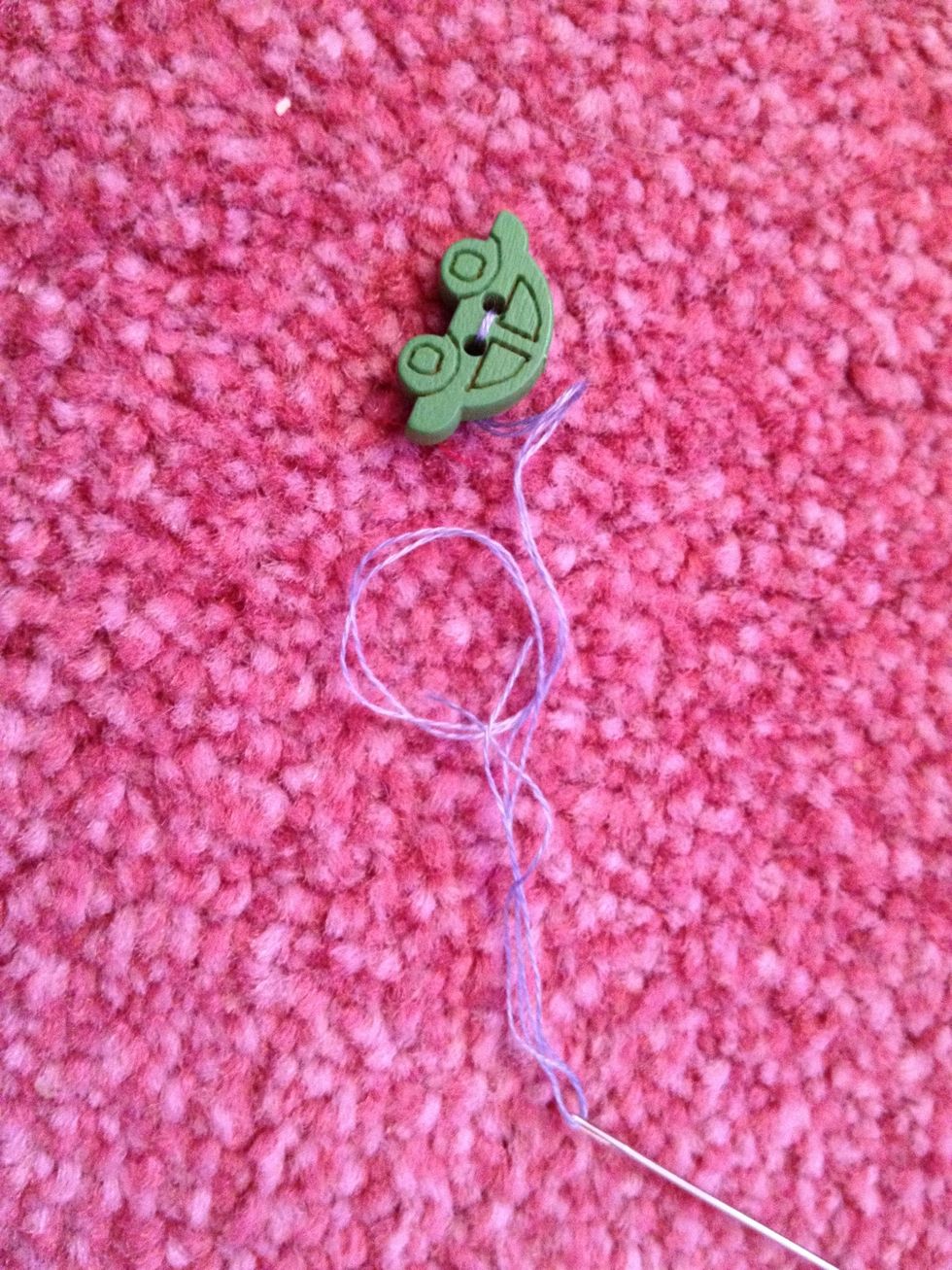 Thread cotton through buttons