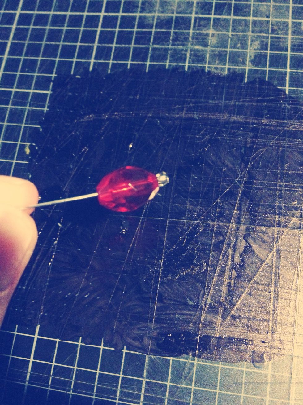 Thread it on above the cap bead.