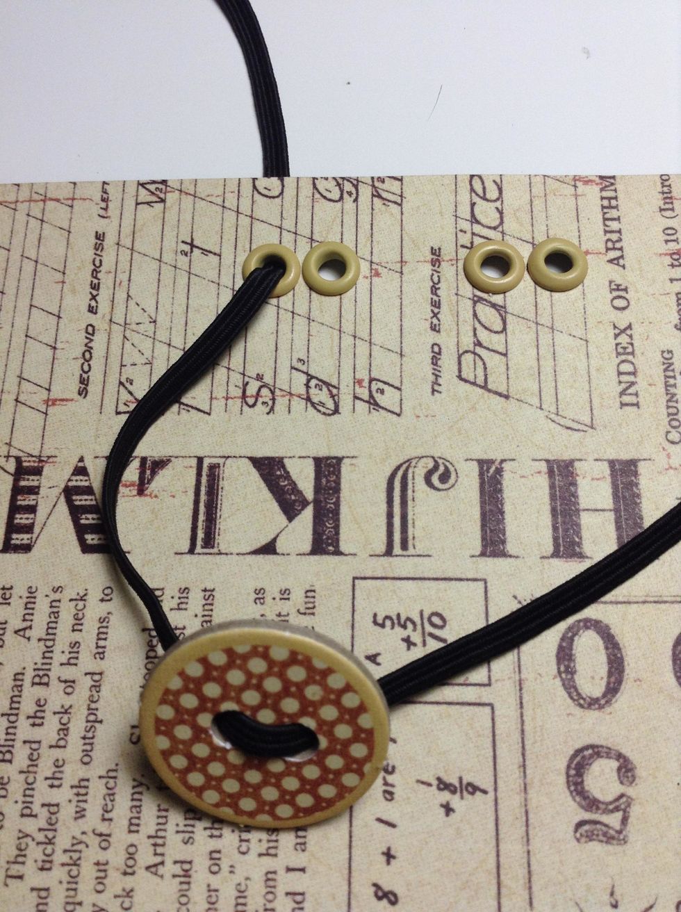 Thread one tail of elastic twine through the eyelete..through the front first hole and pull the tails through the back hole.