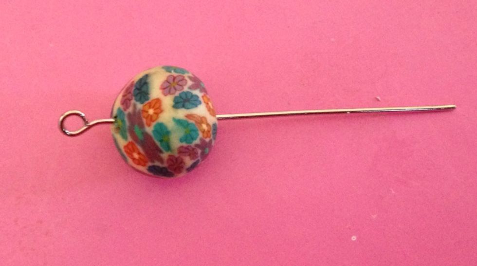 Thread the bead onto the eye pin