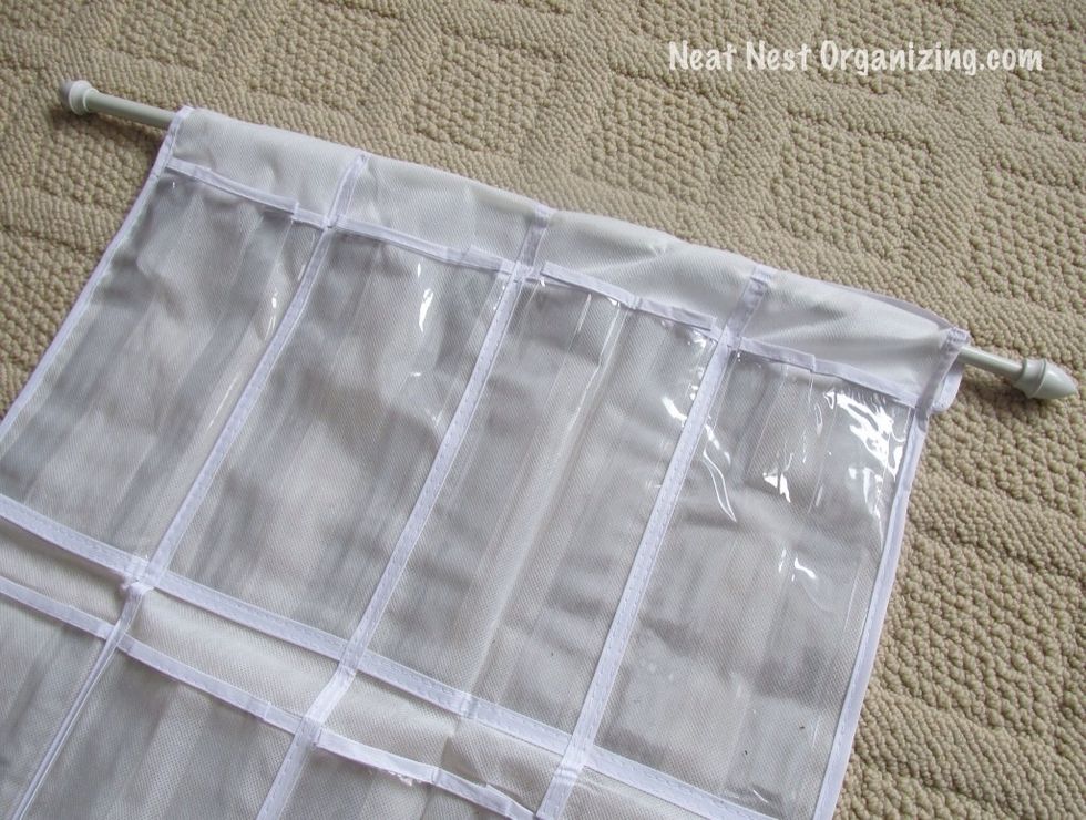Thread the curtain rod through the pocket at the top.