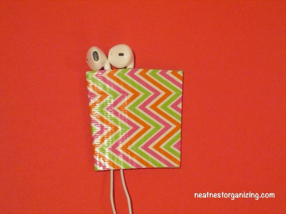 Thread the earbuds through. Line them up at the top.