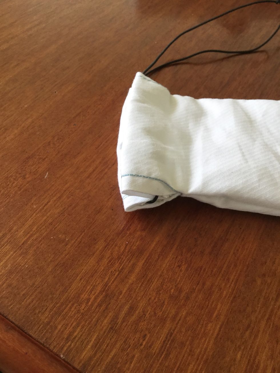 Thread the elastic or ribbon through the open holes after sewing down the edges, tie a knot and hide it in the material. Enjoy you glasses case!\ud83d\ude00