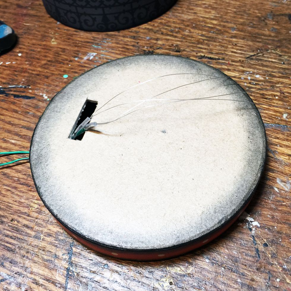 Thread the LEDs through the hole in the box as shown.