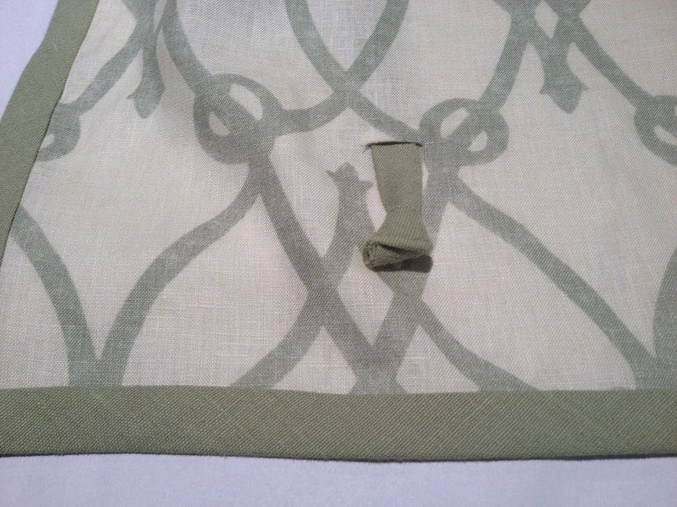 Thread the tie through from the back of the shade to the front using the small opening you made at the bottom of the shade.