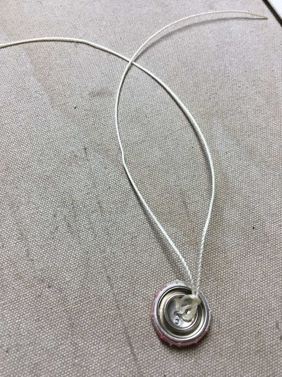 Thread them with tufting twine or dental floss. Make sure you have enough length to go through the foam and plenty to tie off. I cut mine 18" long. Double the strands if you are using dental floss.