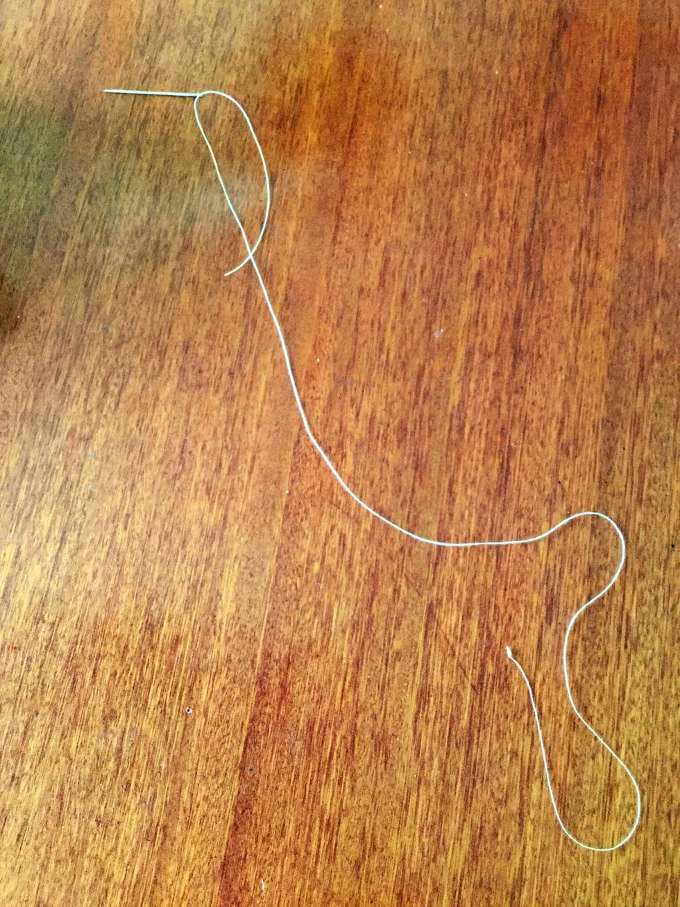 Thread your needle with the thread.