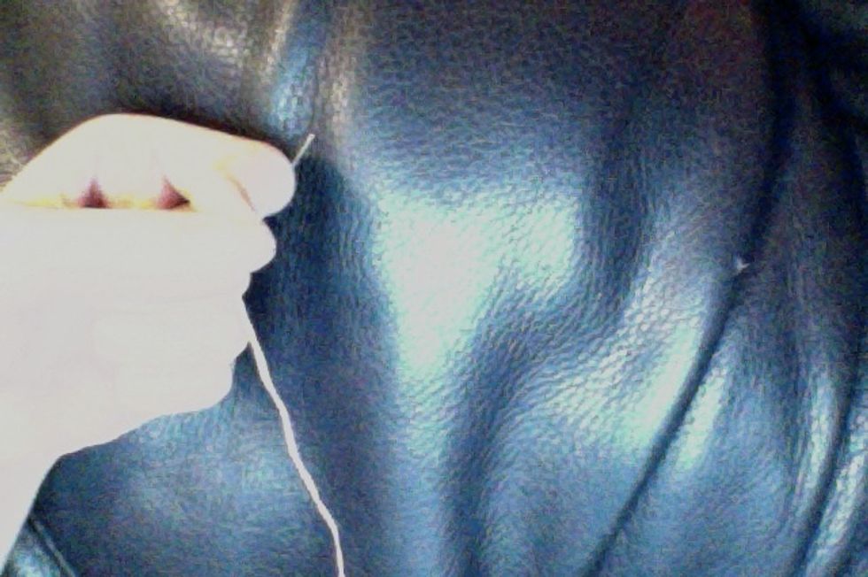 Thread your needle with thread that somewhat matches the color of your frosting felt.