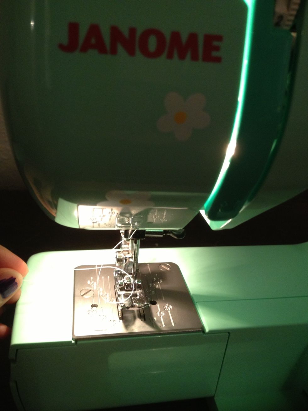 Thread your sewing machine with a color thread that matches your fabric. I'm using pink in the bobbin and white on top.