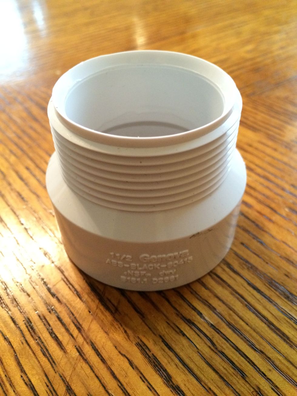 Threaded PVC end to fit over the other end of the 1 1/2" PVC pipe.