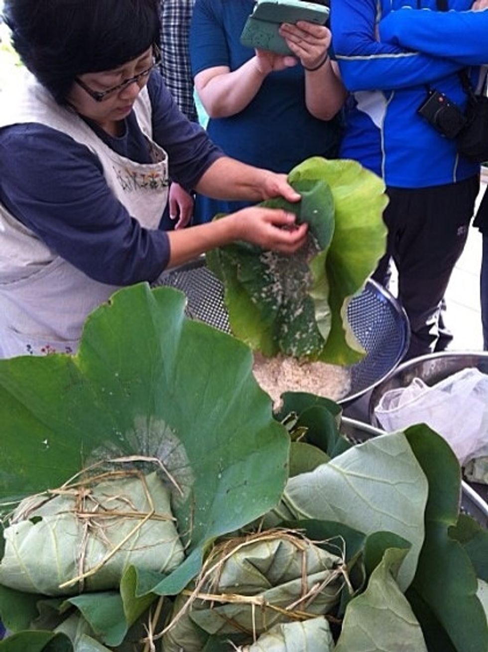 Three days later,open the lotus leaf and filter mixture inside of leaf with sanitized fabric.