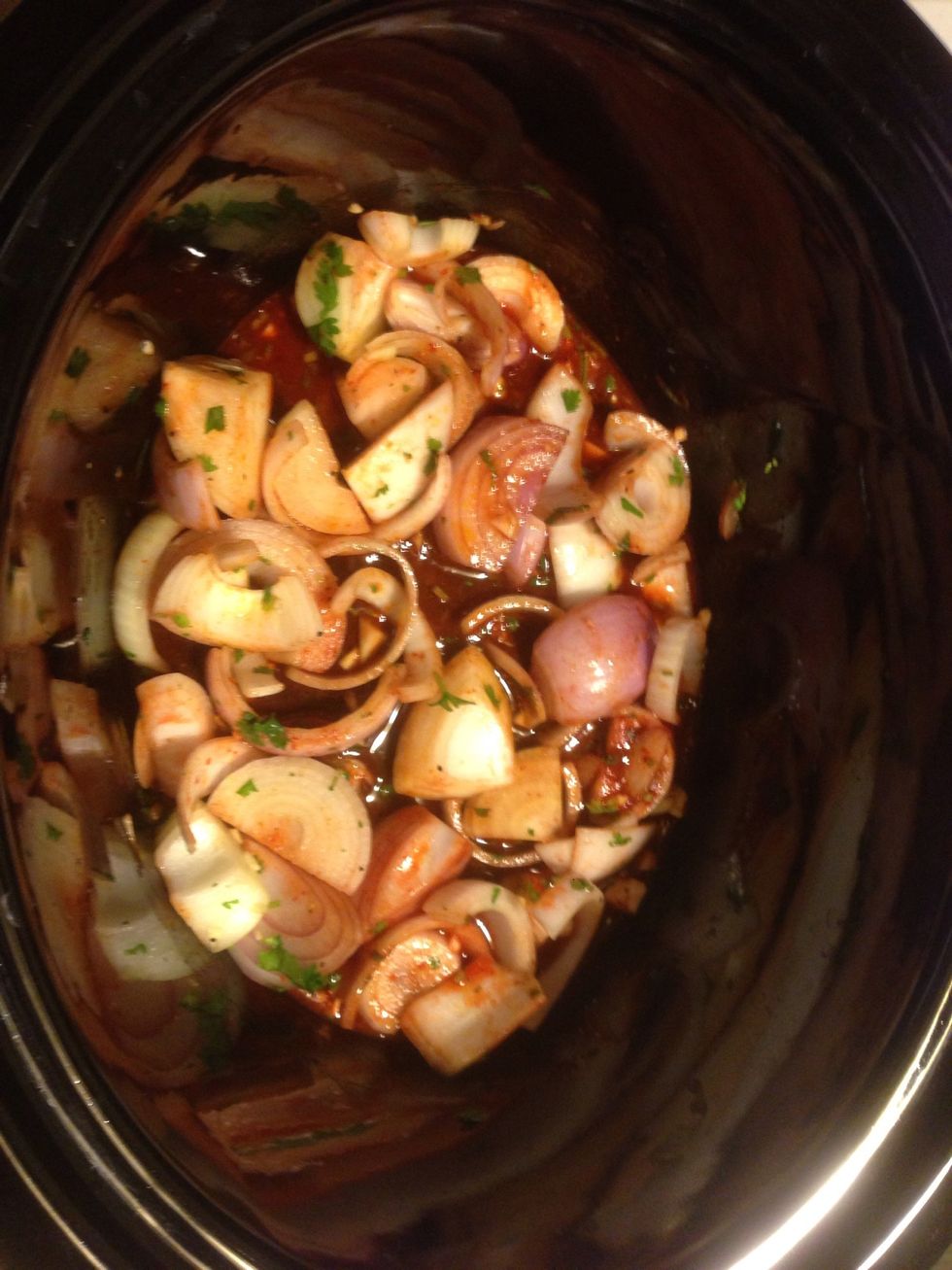 Threw the onions mixture in the pot. But saved about a quarter of the mix to throw on top. Also added the enchilada sauce at this time.