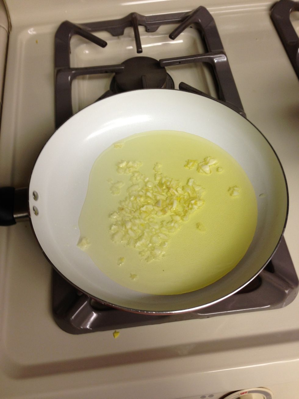 Throw garlic into pan and let simmer do not burn garlic!