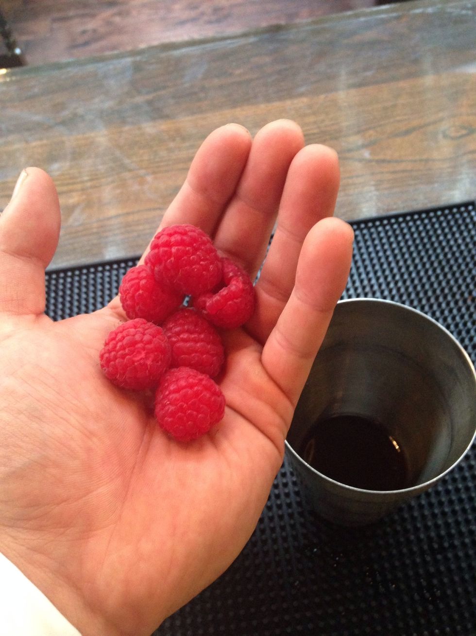 Throw in 6 whole raspberries and 15ml (3/4oz) of fresh orange juice.