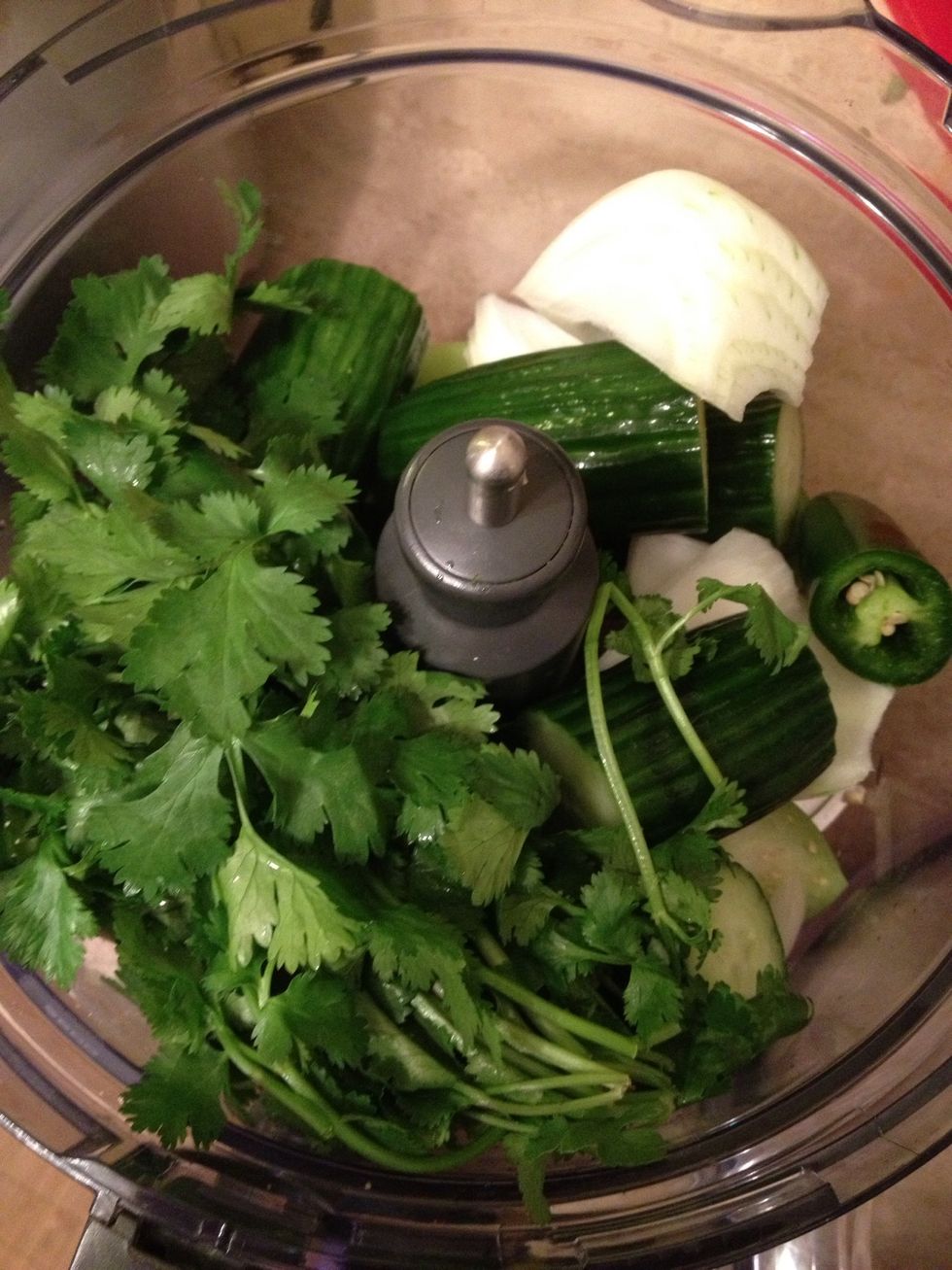 Throw in all veggies and herbs minus the limes and avocado.