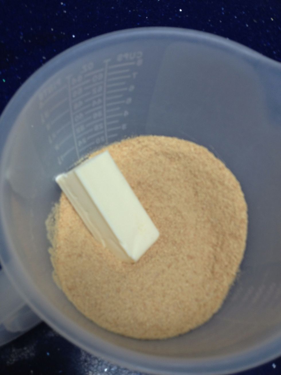 Throw it in the bowl with the graham cracker crumbs and the sugar