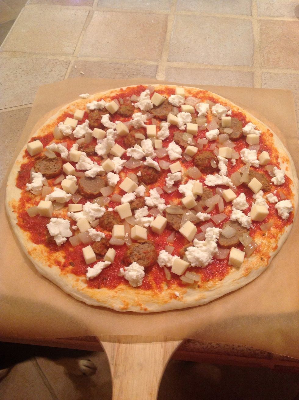 Throw some mozzarella on there to complete the pizza. Finish it with a big pinch of kosher salt and throw it in your oven for around 8 to 9 minutes.